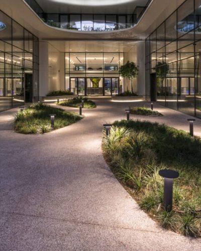 Lighting Design by Danilof Light + Visual Perception Studio | architecture by LC Architects & Vikelas Architects Exterior view of entrance atrium, The Orbit - Urban Office Campus, Athens Greece, lighting design by Danilof Light + Visual Perception Studio | architecture by LC Architects & Vikelas Architects, photographed by © Pygmalion Karatzas.